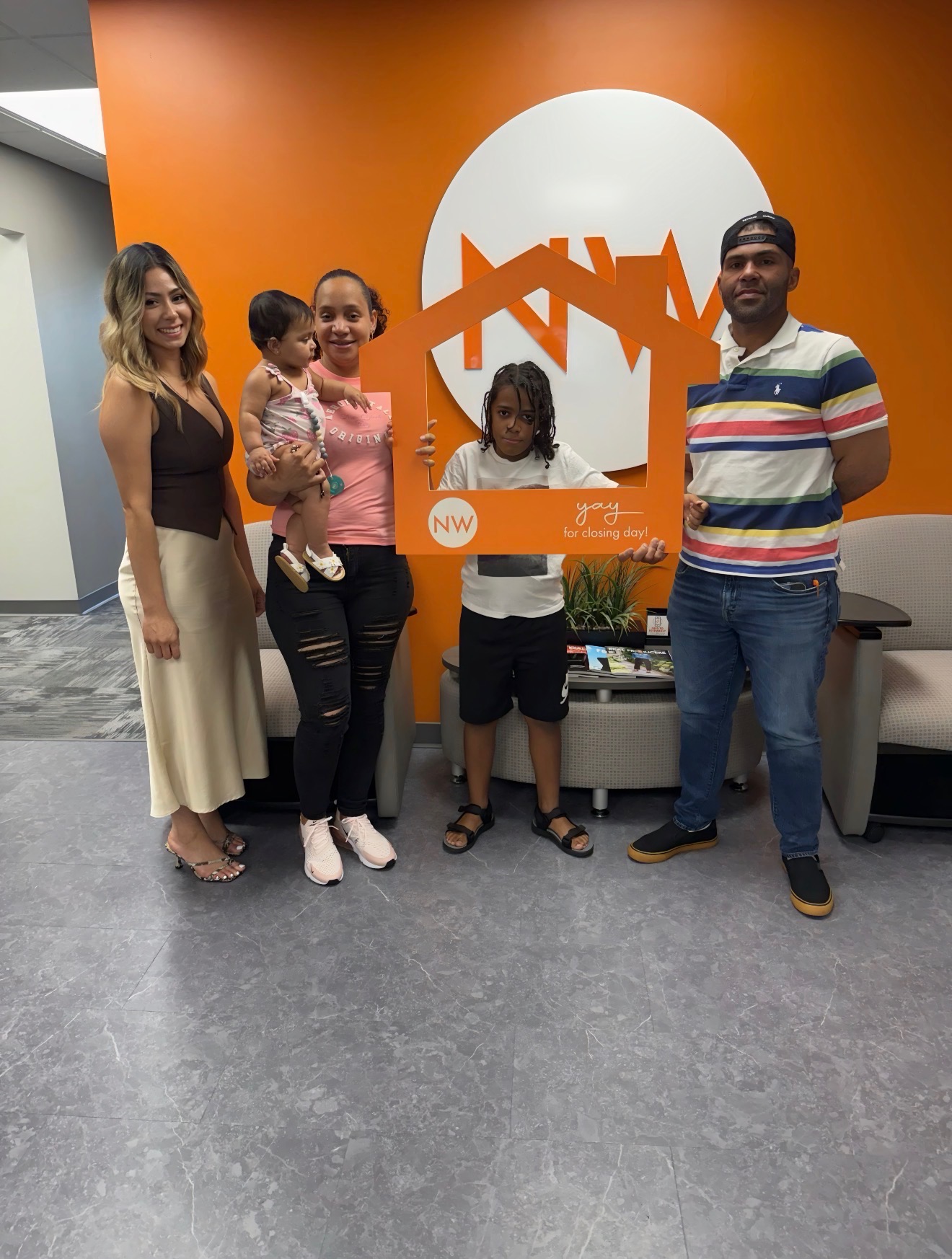 Brenda Garcia with clients on closing day