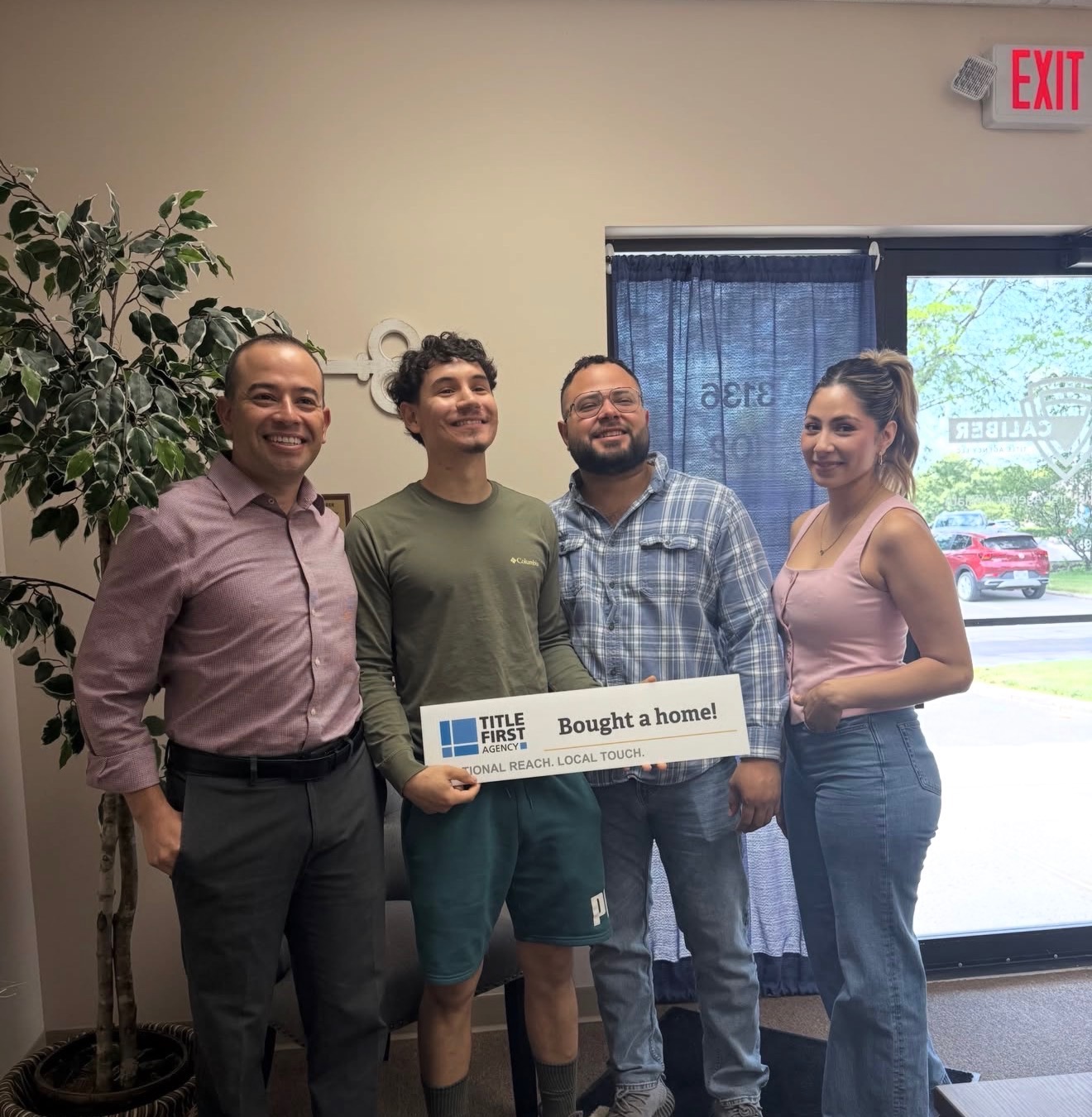 Brenda Garcia with clients after buying a home